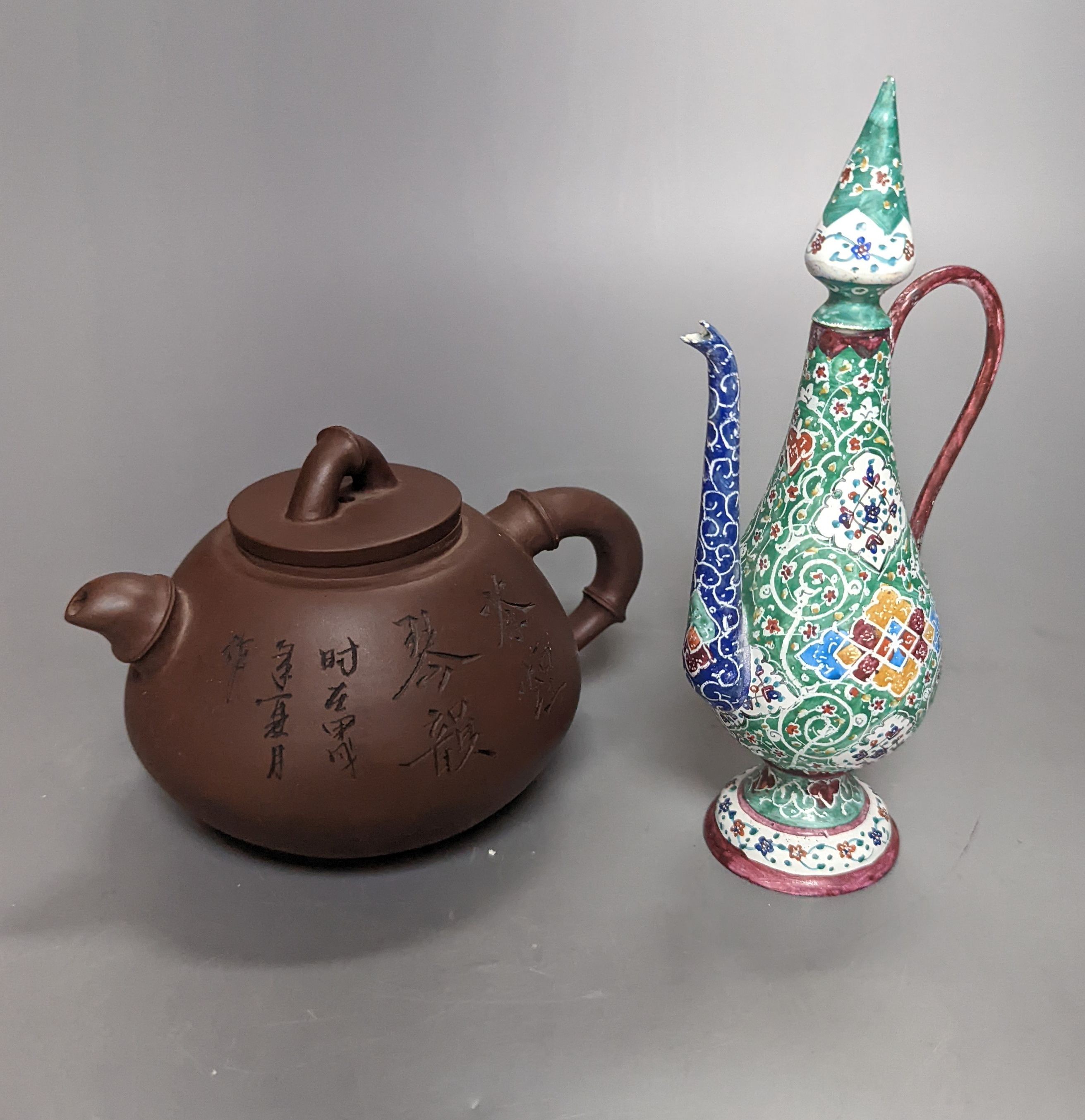 A Chinese Yixing teapot and a Isfahan enamel on copper ewer, 16.5cm high